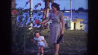 Florida (1945): Mother And Daughter Needing Red Flowers With A Beautiful Lake