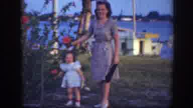 Florida (1945): Little Girl And Her Mom Smelling Roses On A Paradise Island