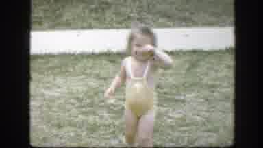 Florida (1945): A Girl Dressed In A Yellow Swimsuit Standing On A Lawn Covering