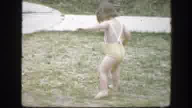 Florida (1945): Child In Swimsuit Walking On Grass