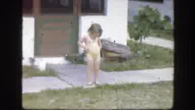Florida (1945): A Little Girl Looks At Her Yellow Swimming Suit While Another