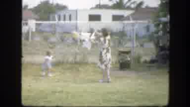Florida (1945): Girl Plays In Her Backyard While Her Mom Removes Dry Clothes From