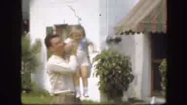 Florida (1945): Man Playing With Child In The Garden And Child Delivering A Yellow