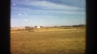 Aspen Colorado (1961): Driving On Street With Shrub Vegetation Landscape And Blue