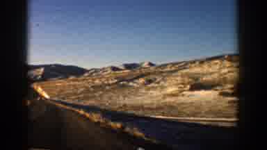 Aspen Colorado (1961): Driving Out Town Towards The Mountains Looking At The