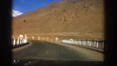 Aspen Colorado (1961): A Road In The Middle Of The Mountains Registered From A Car