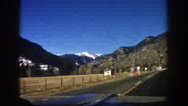 Aspen Colorado (1961): A Mountainous Landscape With Some Houses Registered From A