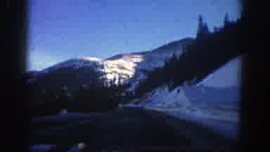 Aspen Colorado (1961): Driving On The Road With Beautiful View Of Snow-Capped
