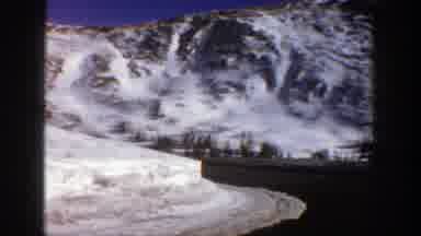 Aspen Colorado (1961): Driving A Car Down The Mountain On A Road Full Of Snow