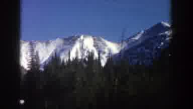 Aspen Colorado (1961): Driving Through The Tall Mountains Looking At The Snow