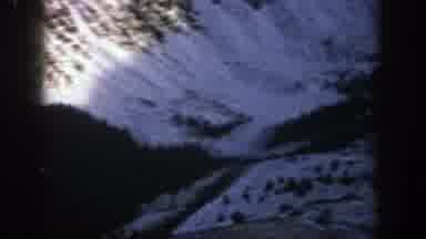 Aspen Colorado (1961): View Of Snow Covered Mountains And Green Trees On A Sunny