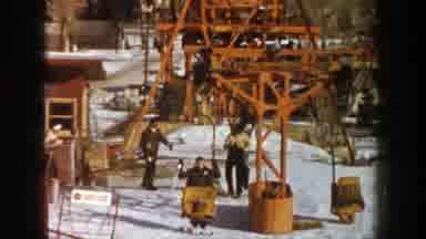 Aspen Colorado (1961): Skiers Getting On And Off Of A Ski lift In The Snow
