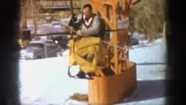 Aspen Colorado (1961): Man On Ski Lift Going Backwards