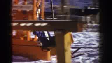Aspen Colorado (1961): A Young Woman Wearing Blue Winter Clothes And Sitting At A