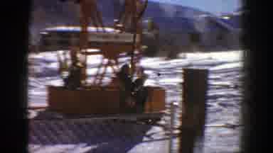 Aspen Colorado (1961): A Skier Starts A Ride In A Ski Lift Followed By An Aerial