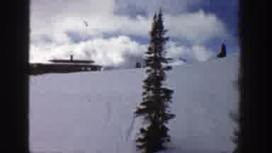 Aspen Colorado (1961): View Of Brown Building On Top Of Snow Covered Hill On A