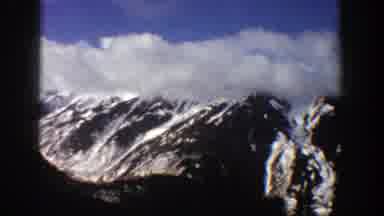Aspen Colorado (1961): Many Giant Snowy Mountains With A Blue Sky Full Of White