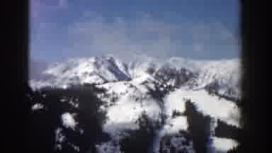 Aspen Colorado (1961): View Of Snow Covered Mountains And Blue Sky On A Clear Day