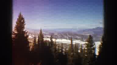 Aspen Colorado (1961): Panoramic View Of Trees Mountains Ahead And Blue Sky With