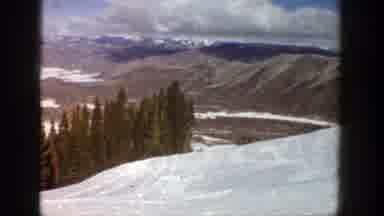 Aspen Colorado (1961): One Person Rides A Chairlift Up The Side Of A Snowy