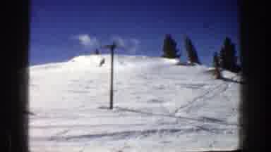 Aspen Colorado (1961): People Skiing On A Bright Day Down A Snowy Slope