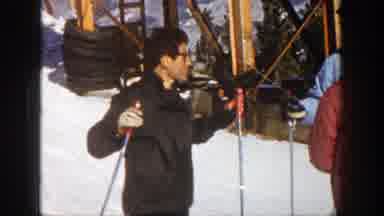 Aspen Colorado (1961): A Man Talking To People Holding Skis Then Starts Skiing