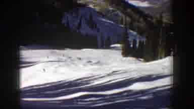 Aspen Colorado (1961): People Skiing On The Snow In The Mountains Surrounded By