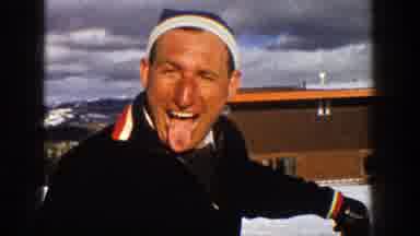 Aspen Colorado (1961): Man Wearing Black Jacket Sticks Tongue Out At Camera On A