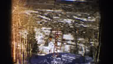 Aspen Colorado (1961): A Chair Lift Is Slowly Going Down After Dropping Off