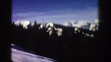 Aspen Colorado (1961): Sweeping View Of Snow Covered Mountain Peaks And Trees On A