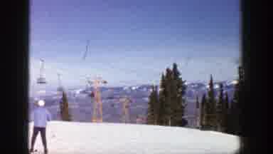 Aspen Colorado (1961): Man In Blue Pants Skiing In The Snow Observing Another