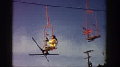 Aspen Colorado (1961): Lady On A Ski Lift Getting Ready To Ski