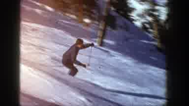Aspen Colorado (1961): Person Wearing Grey Jacket Skis Downhill On A Clear Sunny