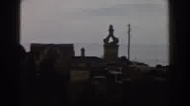 ITALY-1960: A Small Town Surrounded By Old Brick Buildings And Structures On A