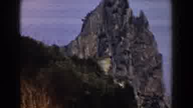 Italy (1960): Tall Rocks With Body Of Water Backdrop
