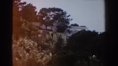 Italy (1960): Desert Landscape Man Made Concrete Wall With A Sign Hanging On The