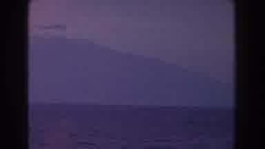 Italy (1960): Blue Sea In The Background There Is A Large Snow-Capped Mountain