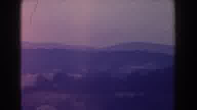 Italy (1960): Sweeping View Of Mountains And Brown Pole On A Hazy Day