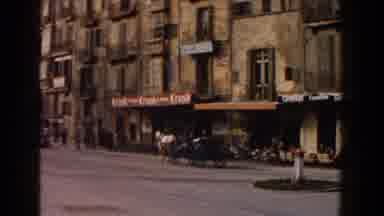 Italy (1960): A Horse Drawn Carriage Walking Leisurely Across A City Street And