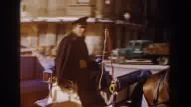 Italy (1960): Man Wearing Black Cape Drives Horse Drawn Buggy On A Sunny Day