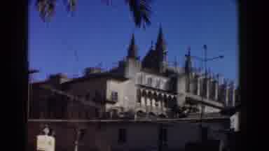 Italy (1960): View Of Tan Building And Blue Sky On A Sunny Day
