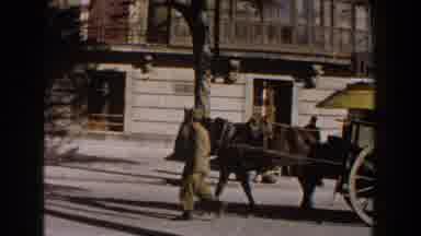 Italy (1960): A Man Guiding His Horse Pulling His Wagon Through The City