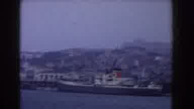 Italy (1960): Panoramic View Of A Boat Sailing On The Sea With Several Buildings