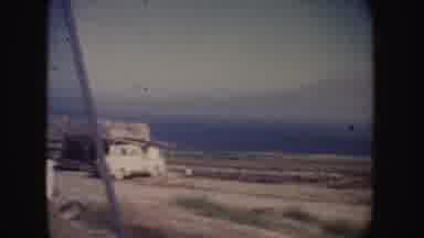 California (1962): View Of Lake Green Trees And Two White Vehicles Parked On Side