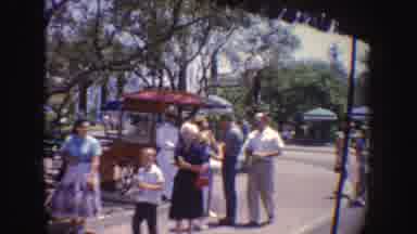 California (1962): A Man Riding On A Horse Drawn Carriage Through An Outdoor Event
