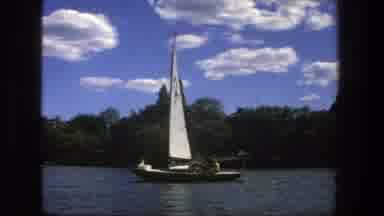 Stockholm Sweden (1975): Sail Boat Speeding Down A River On A Bright Sunny Day