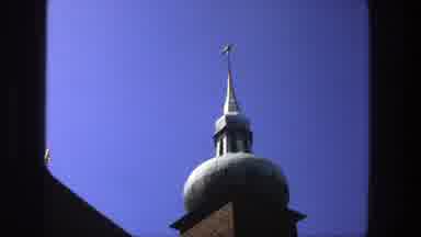 Stockholm Sweden (1975): View Of Brown And White Church Spire Against Blue Sky On