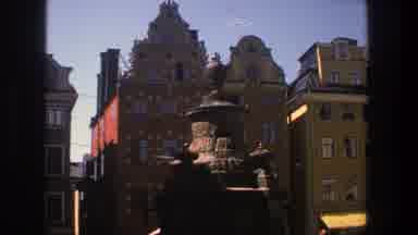 Stockholm Sweden (1975): Four Colorful Buildings Stand Behind A Fountain On A