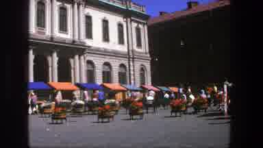 Stockholm Sweden (1975): View Of Green Boat Docked By Brown Building On A Sunny