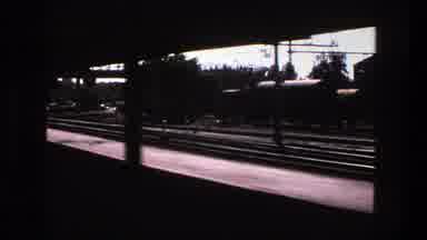 Stockholm Sweden (1975): Passing View Of Train Station Platform On A Clear Sunny